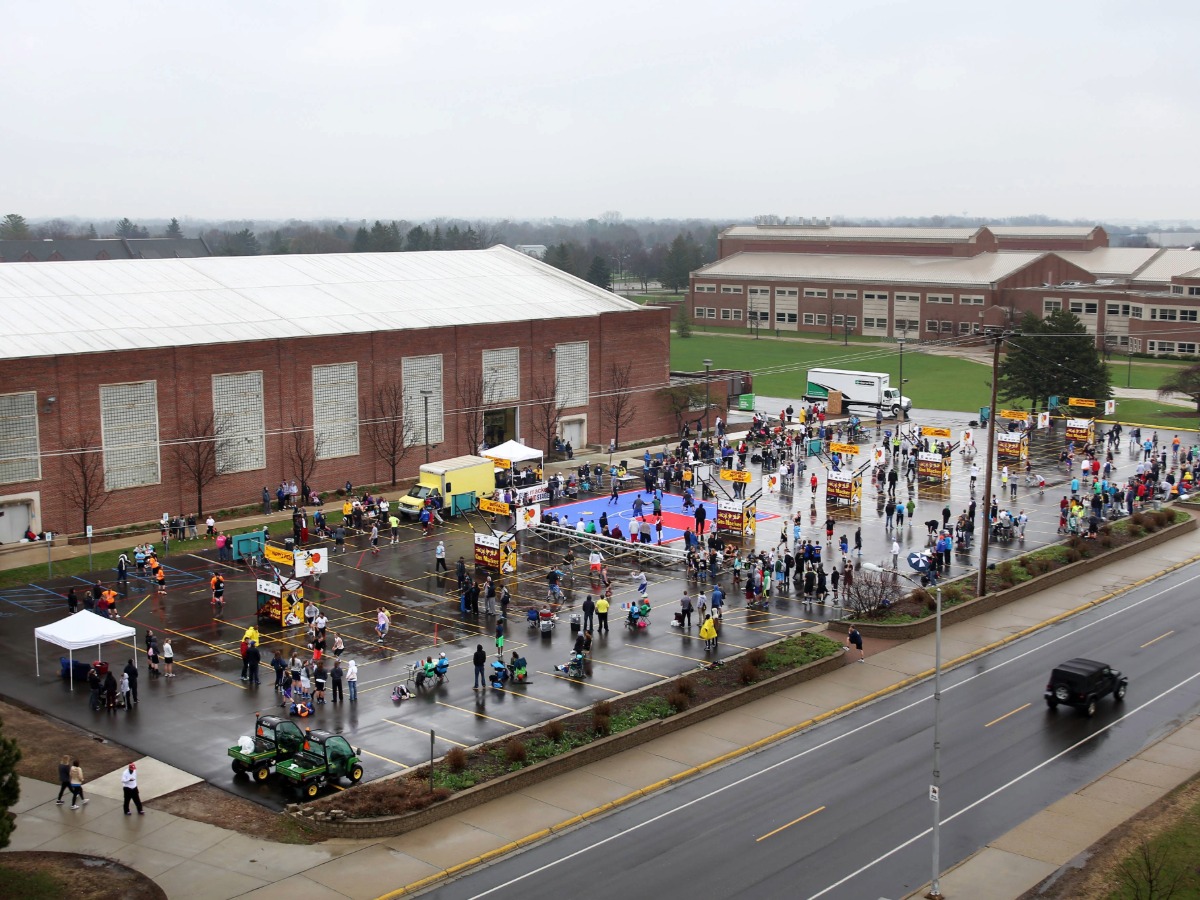 Aerial view of a crowd of people at the Gus Macker event in the Finch parking lot.
