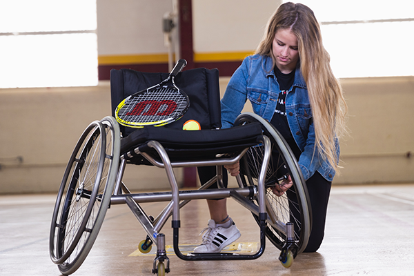 Adaptive wheelchair for tennis.
