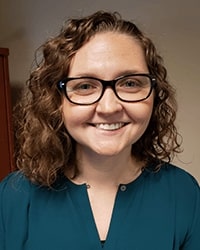 DET Alumni Ashley McBride 200x250 Ashley McBride, a graduate from the Doctorate in Educational Technology program at Central Michigan University, in a blue sweater.