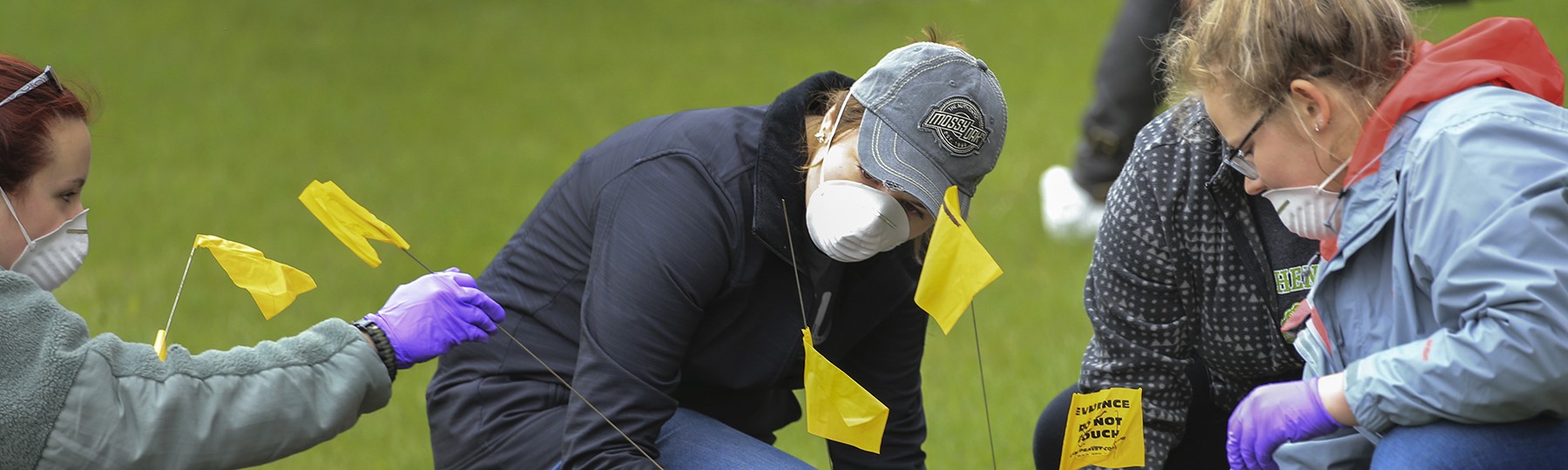 Students investigate a mock crime scene through their forensics anthropology course