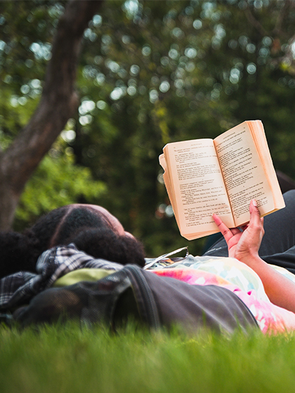 CMU student reading outside