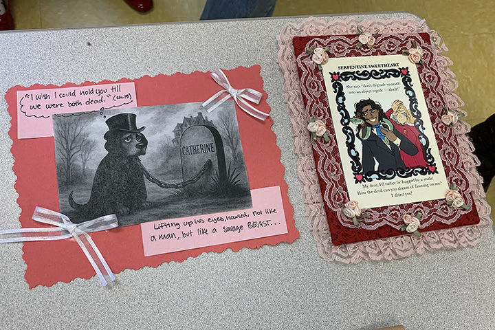 Student-designed bookmarks on decorative red paper with ribbons and lace