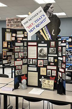 A trifold display featuring images of Susan B. Anthony and a large cutout image of her holding a sign