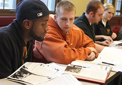 History students review course materials during class