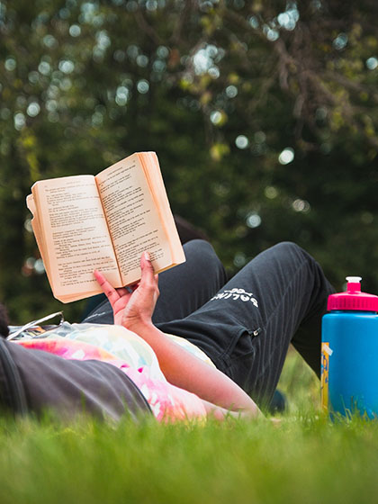 Reading Leaves of Grass outside