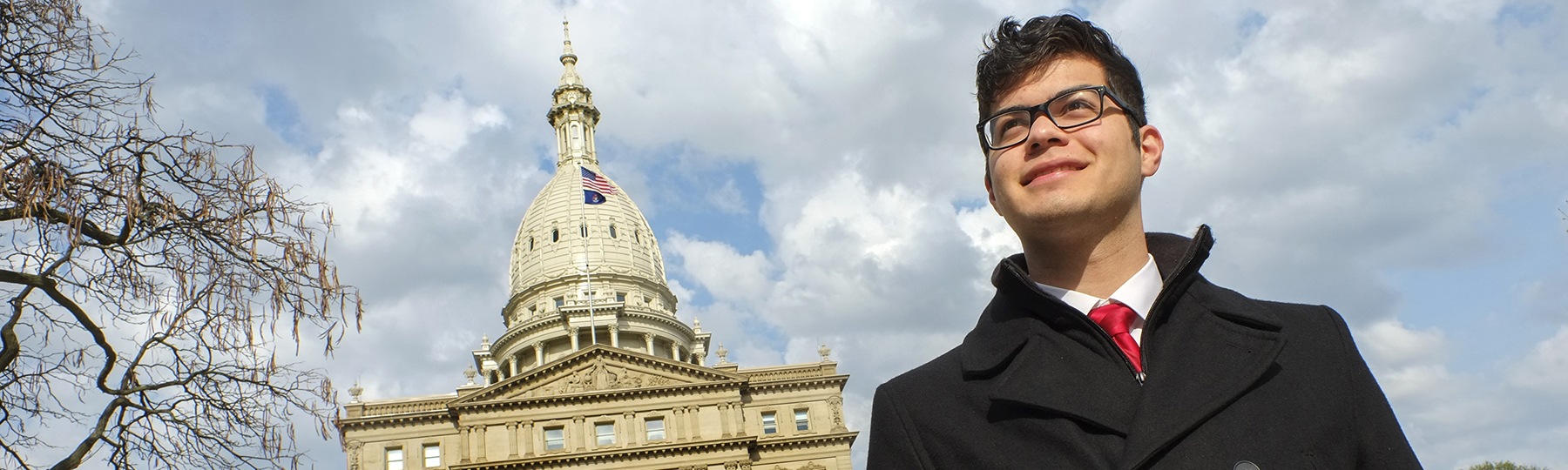 Central Michigan University political science student in front of the capitol building in Lansing