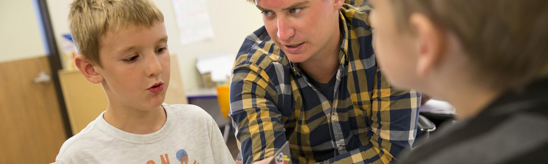 School psychologist working with two boys