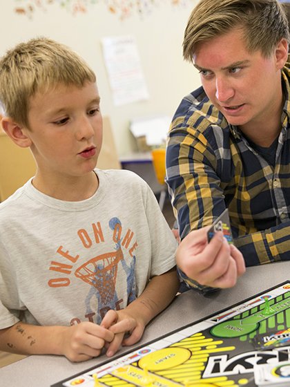 School psychologist working with two boys