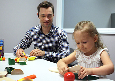 CMU student meets with a child in the Center for Children, Families and Communities