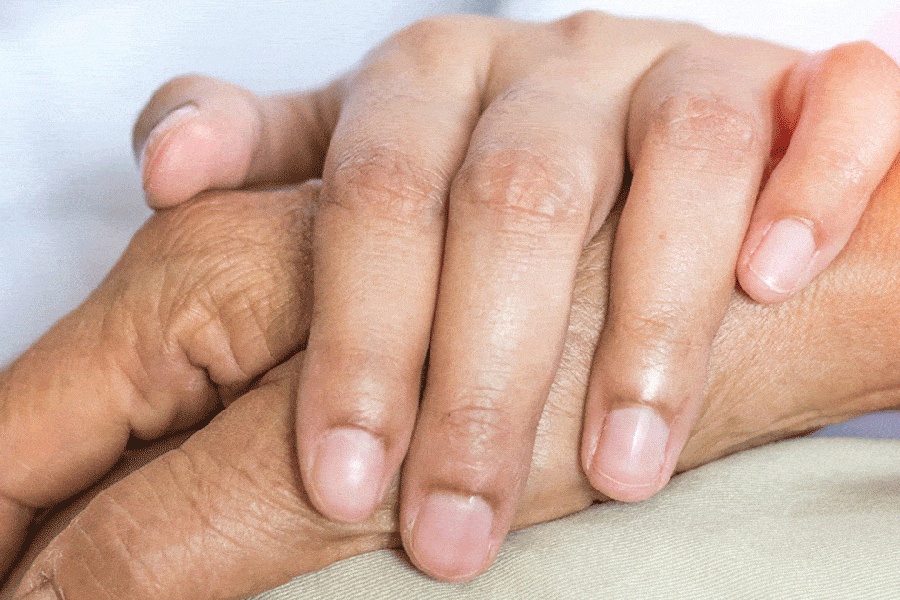 Hand placed on hand