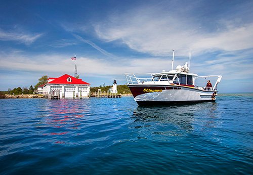 The MV Chippewa on the water in front of the CMU Boathouse on Beaver Island.