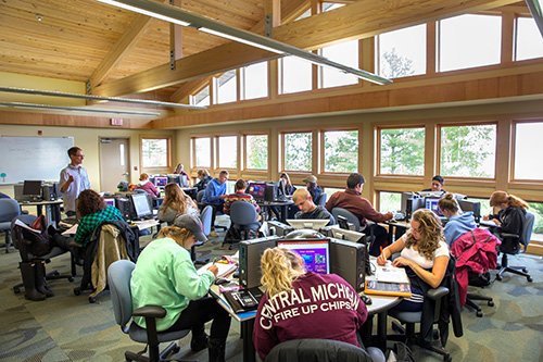 A large group of students in one of the classrooms at the CMU Biological Station on Beaver Island.