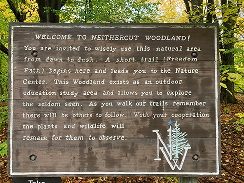The sign posted at the entrance to Neithercut Woodland welcoming visitors to the area.