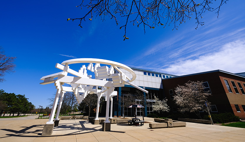 A white art installation is in front of the Engineering and Technology building at Central Michigan University.