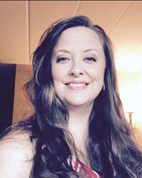 Dr. Katherine Soller, CMU Mathematics Alumnus, smiles at the camera.