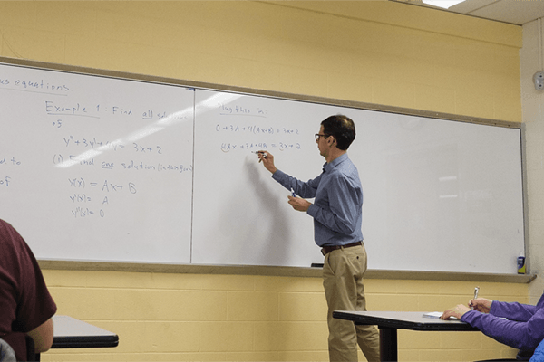 Dmitry Zakharov in a mathematics classroom.