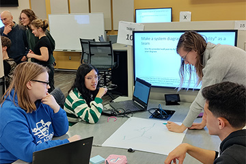 Students participating in an active learning classroom.