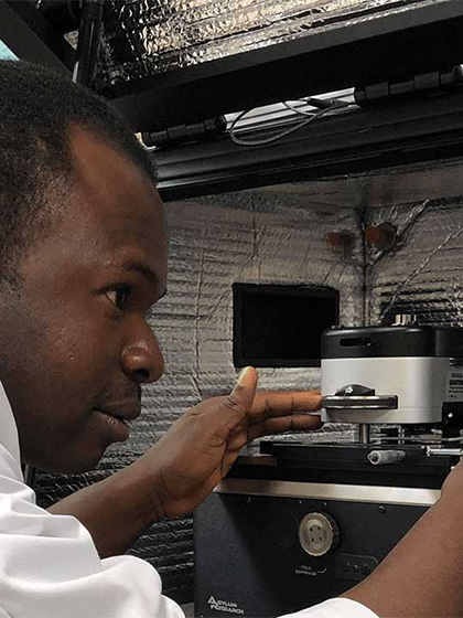 a man analyzing chemical samples in a lab