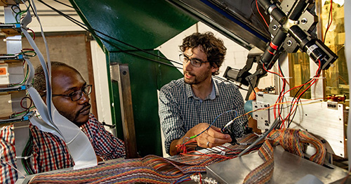 Alfredo Estrade and a Graduate Student preparing equipment for Nuclear Physics experiments
