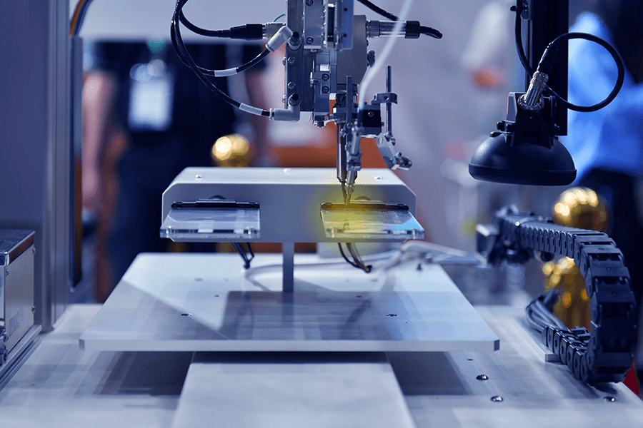 A machine etches metal for a design created by an electrical engineering major.