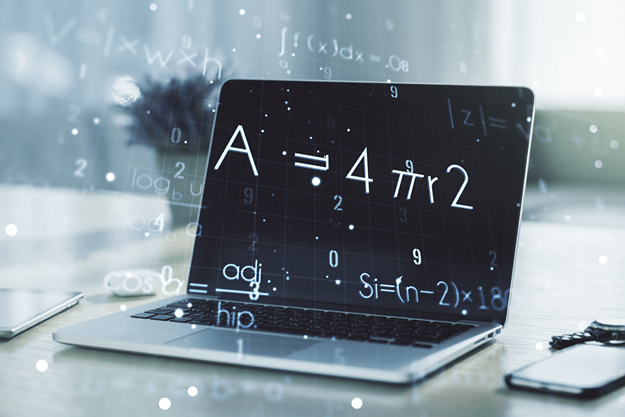 Mathematical equations overlaid on a picture of a laptop.