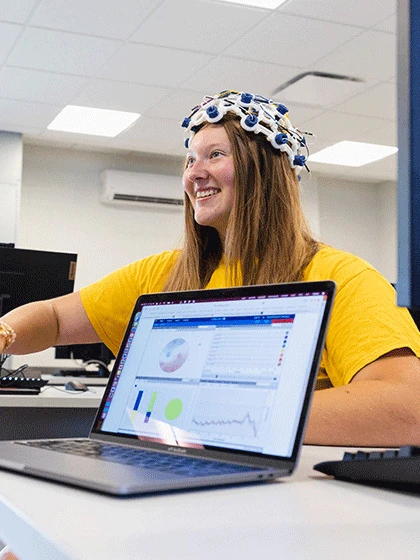 A student staring at a computer screen.