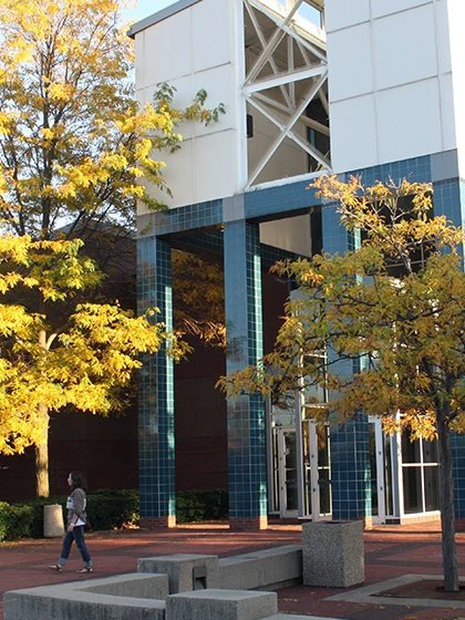 a woman walking past a building