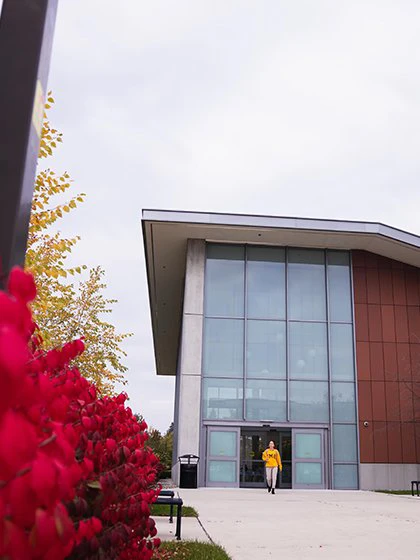 A student leaves the Biosciences Building at Central Michigan University.