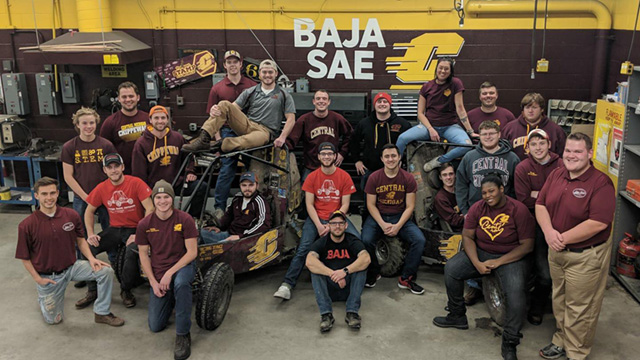 CMU Baja Team posing with 2 baja cars
