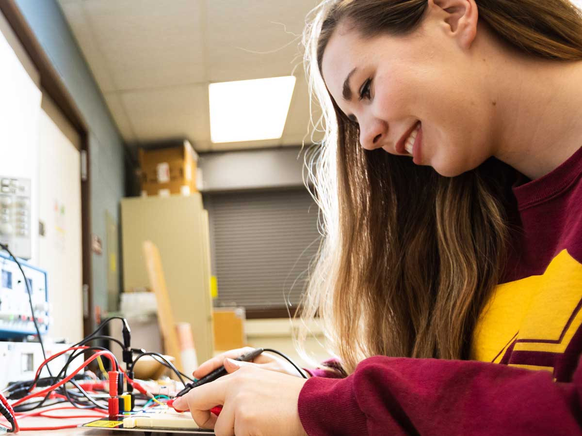 Student in electrical engineering lab.