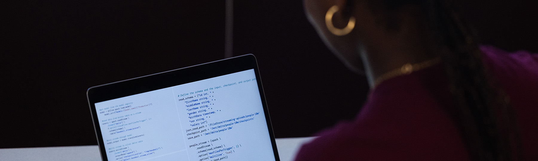 A student looking at a screen full of data.