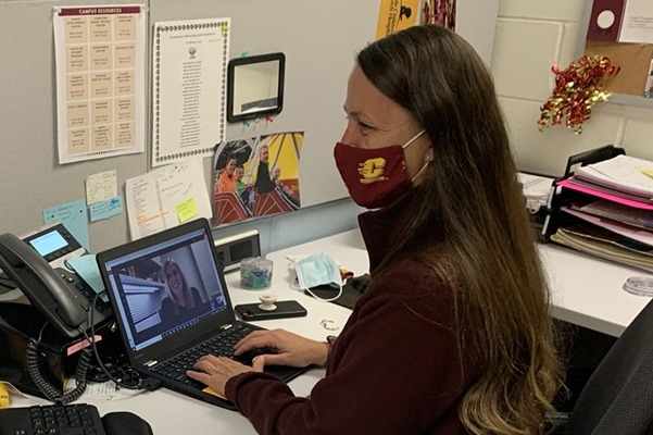 Academic advisor working virtually with a student.