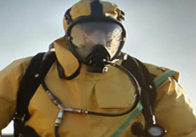 Environmental Health and Safety student in hazmat suit