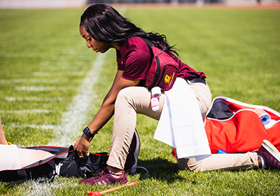 Athletic trainer on a football field