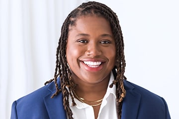 Professional headshot of Dr. Jasmine Simmons against a white background.