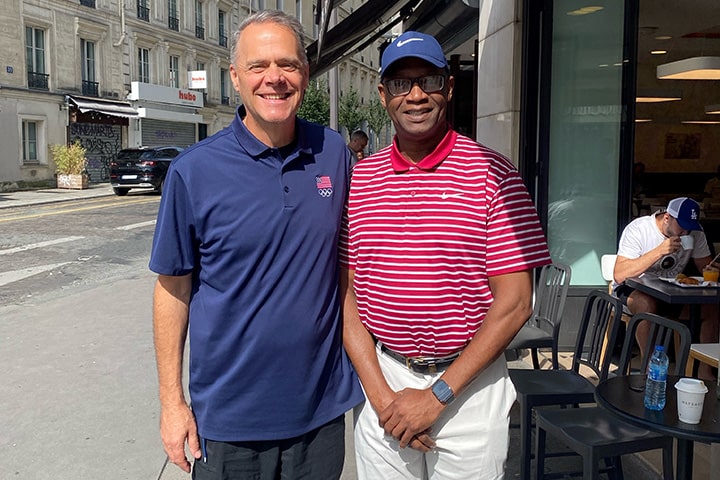 Kelly Skinner and Dr. Vincent Mumford standing together and smiling in Paris, France.