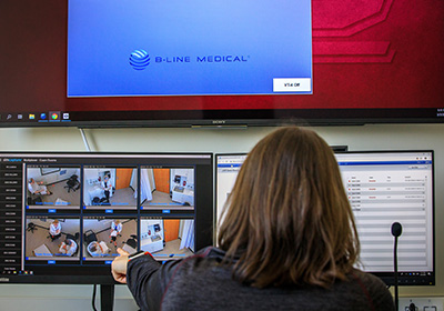 Health Sciences student looks over computer data