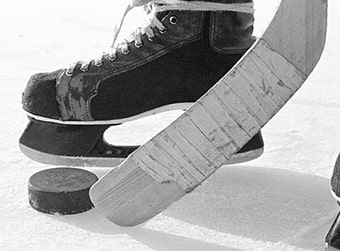 Ice hockey stick, puck, and skate