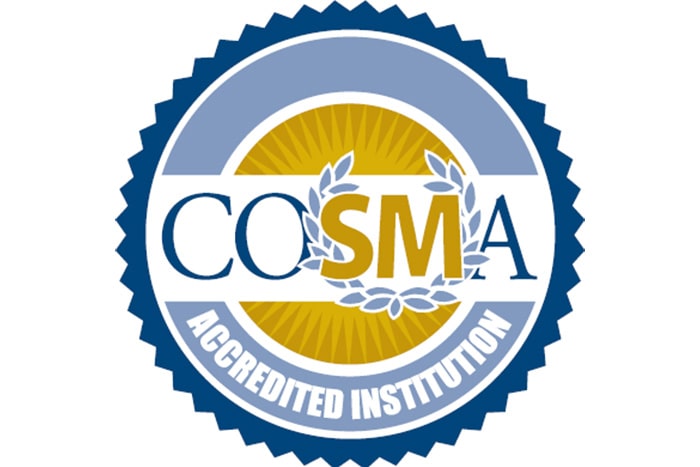 The logo for the Commission on Sport Management Accreditation, in blue and gold text, in a blue and gold circular seal shape.