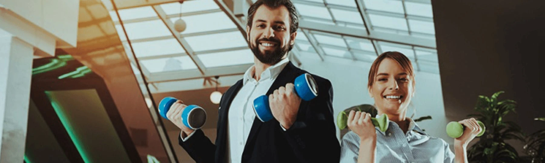 Two people holding dumbbells