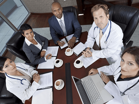 Doctors at a conference table