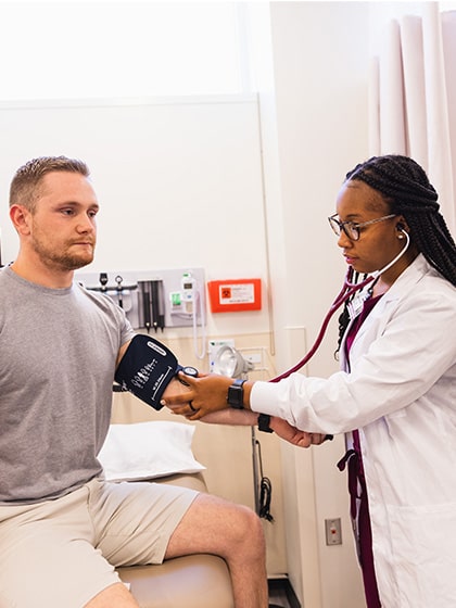 Physician assistant examining a patient.