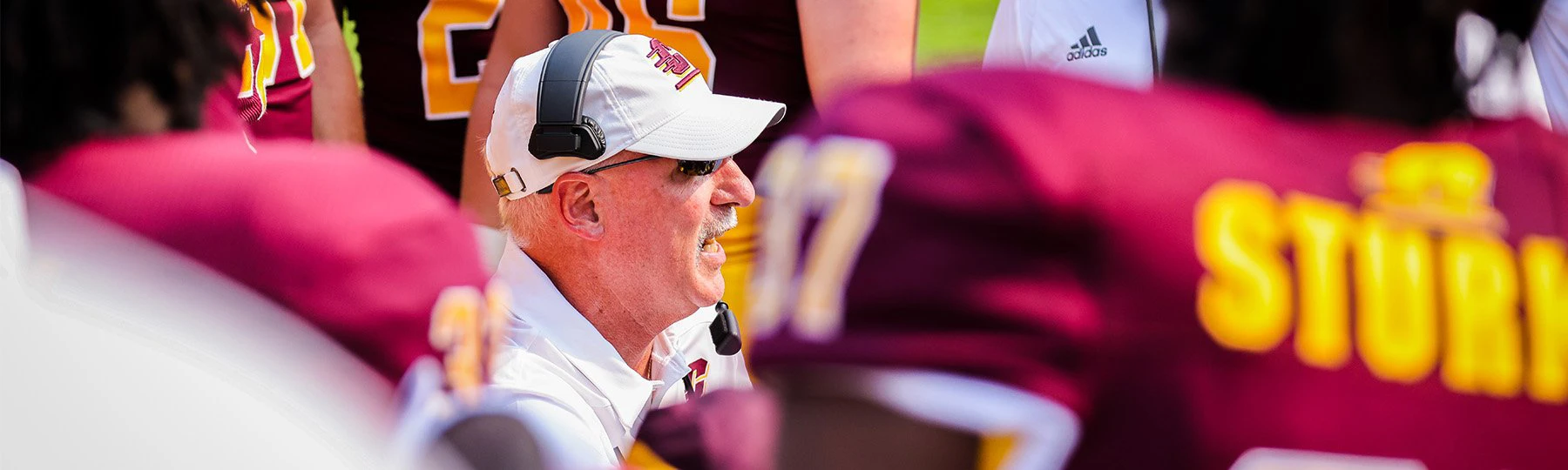 football coach in a huddle