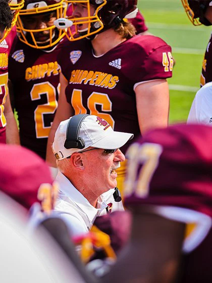 football coach in a huddle