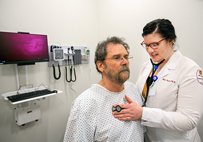 Physician Assistant student examining a patient