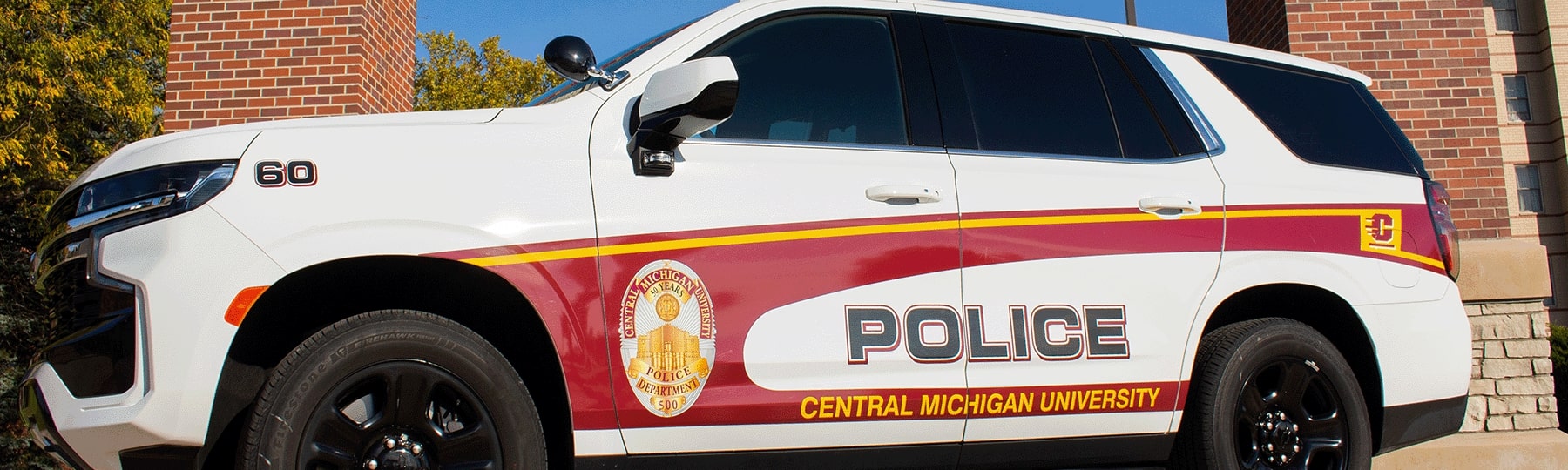Central Michigan University Police Vehicle in front of the arch.