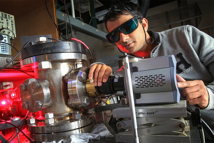 Neerajan Nepal working with mechanical components.