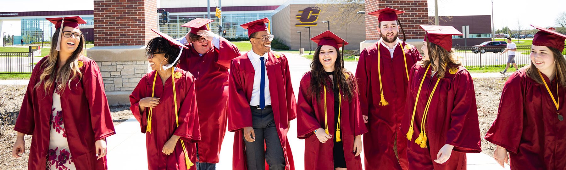 graduates walking to Commencement