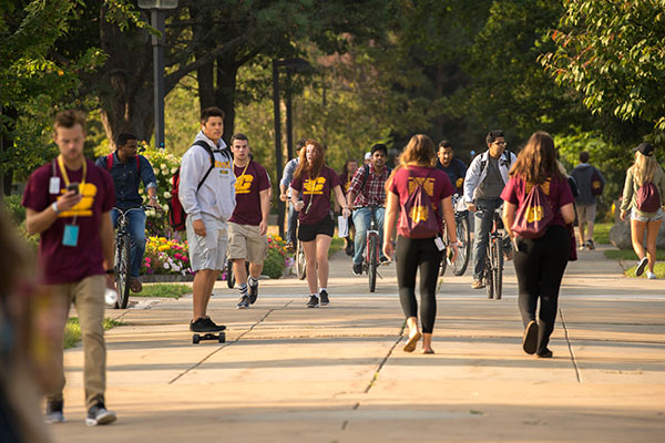 Students walking in campus courtyard at CMU