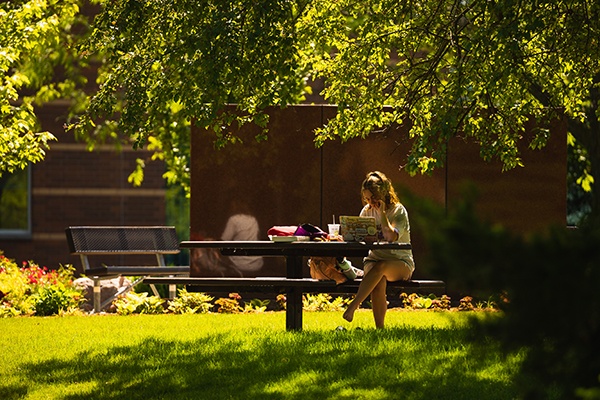 Student having lunch outdoors